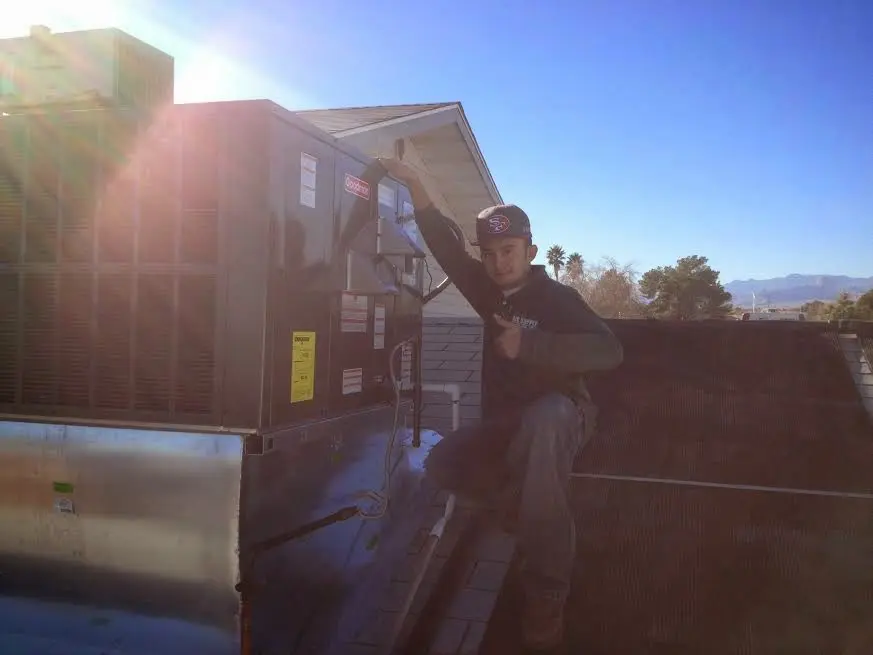 HVAC technician performing HVAC Inspection on a rooftop unit in La Crescenta-Montrose